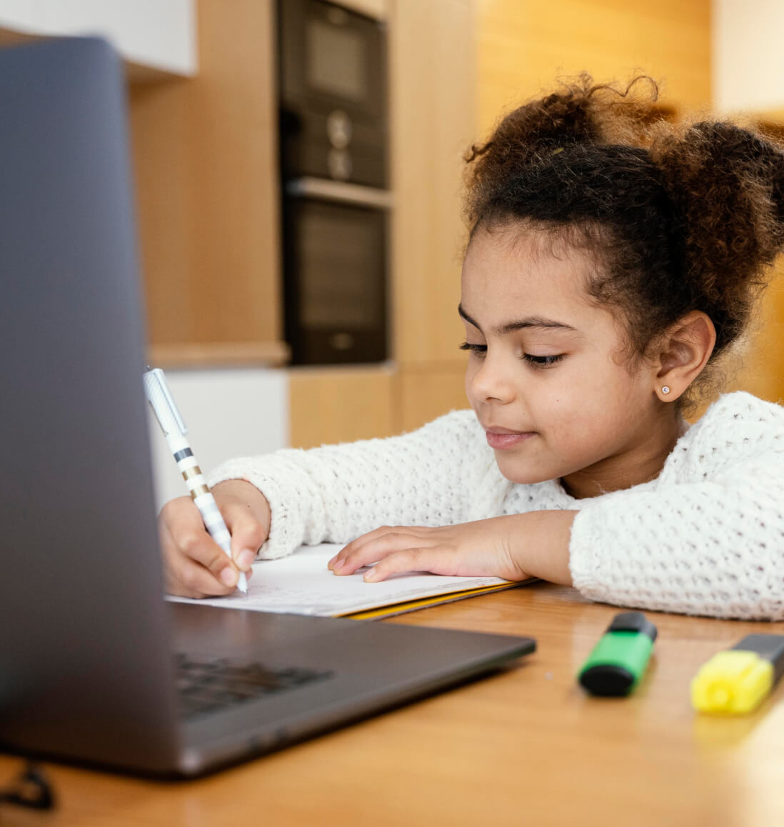 Young student focused on solving a math problem on a worksheet as part of kids math tutoring.