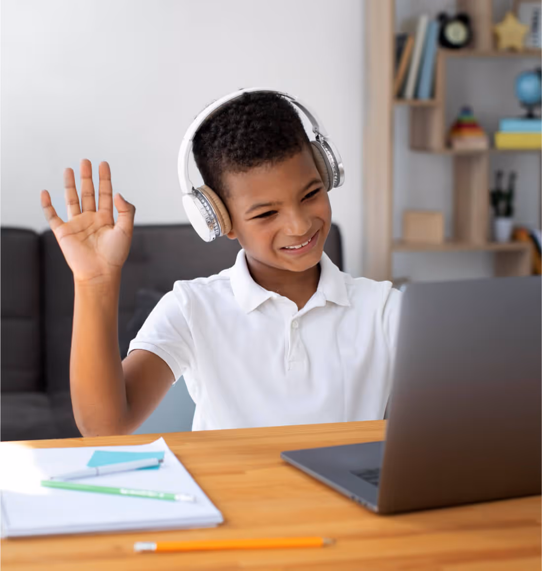 Student waving, engaged in learning advanced Algebra concepts via online math tutoring for Curriculum Level 10.