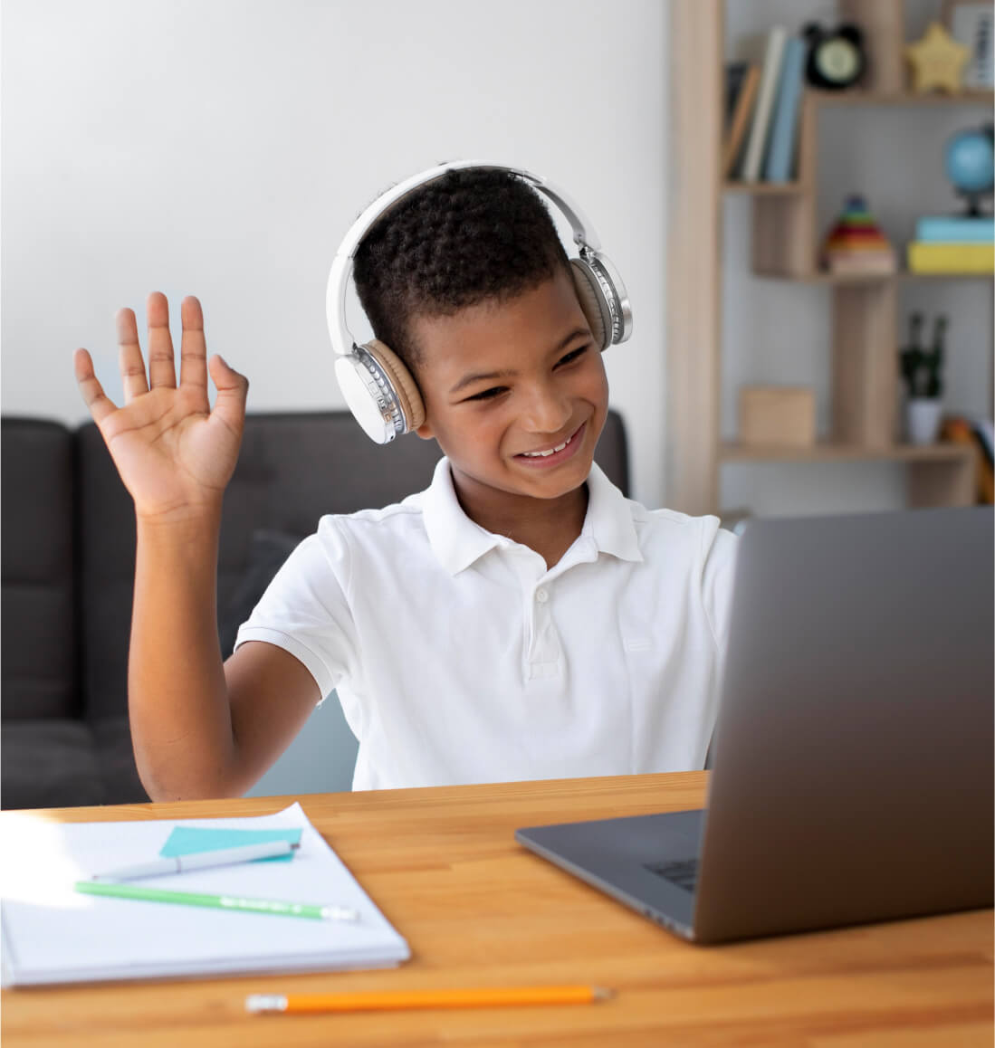 Student waving, engaged in learning advanced Algebra concepts via online math tutoring for Curriculum Level 10.