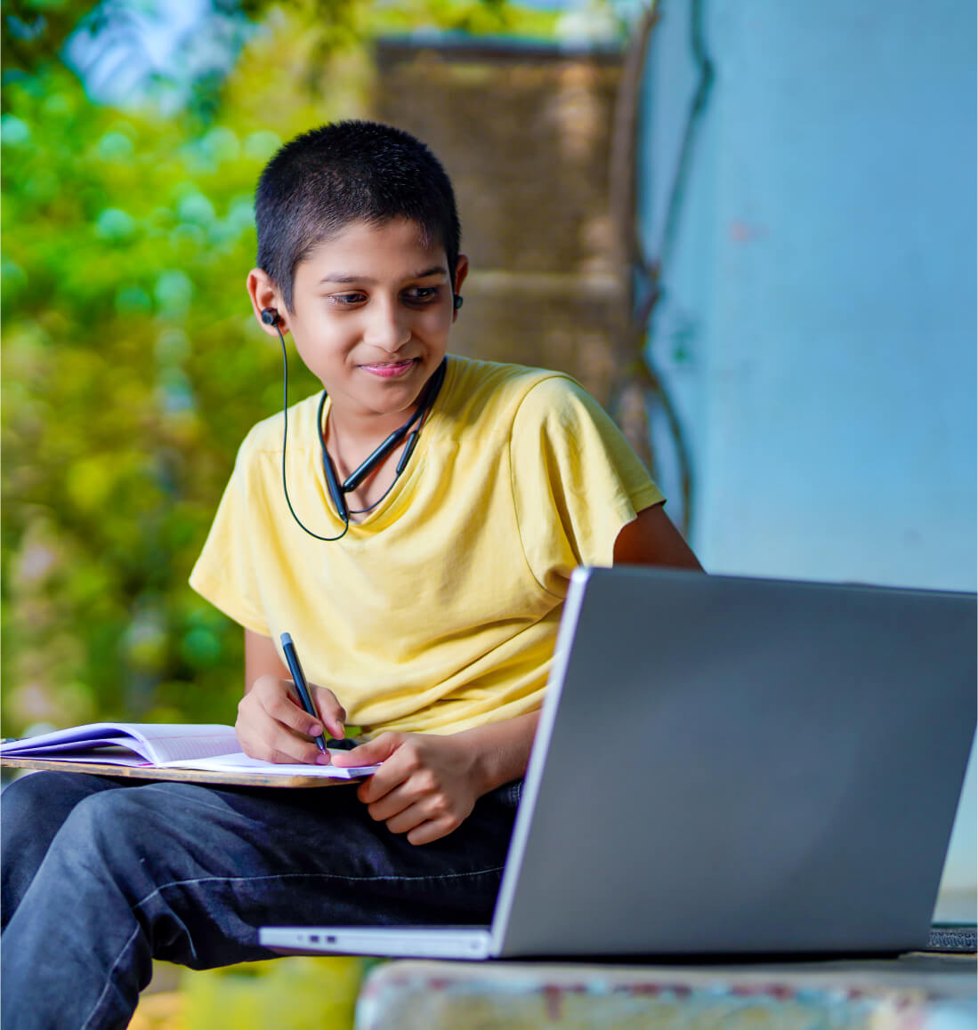 Student taking notes while learning advanced algebra concepts via online math tutoring for Curriculum Level 11.