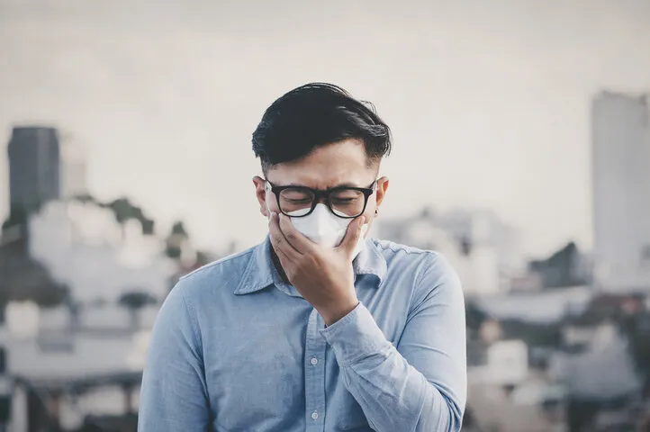 man coughing with wearing white masks