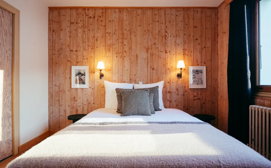 Premium room with double bed at Le Caprice des Neiges, decorated in warm chalet style.
