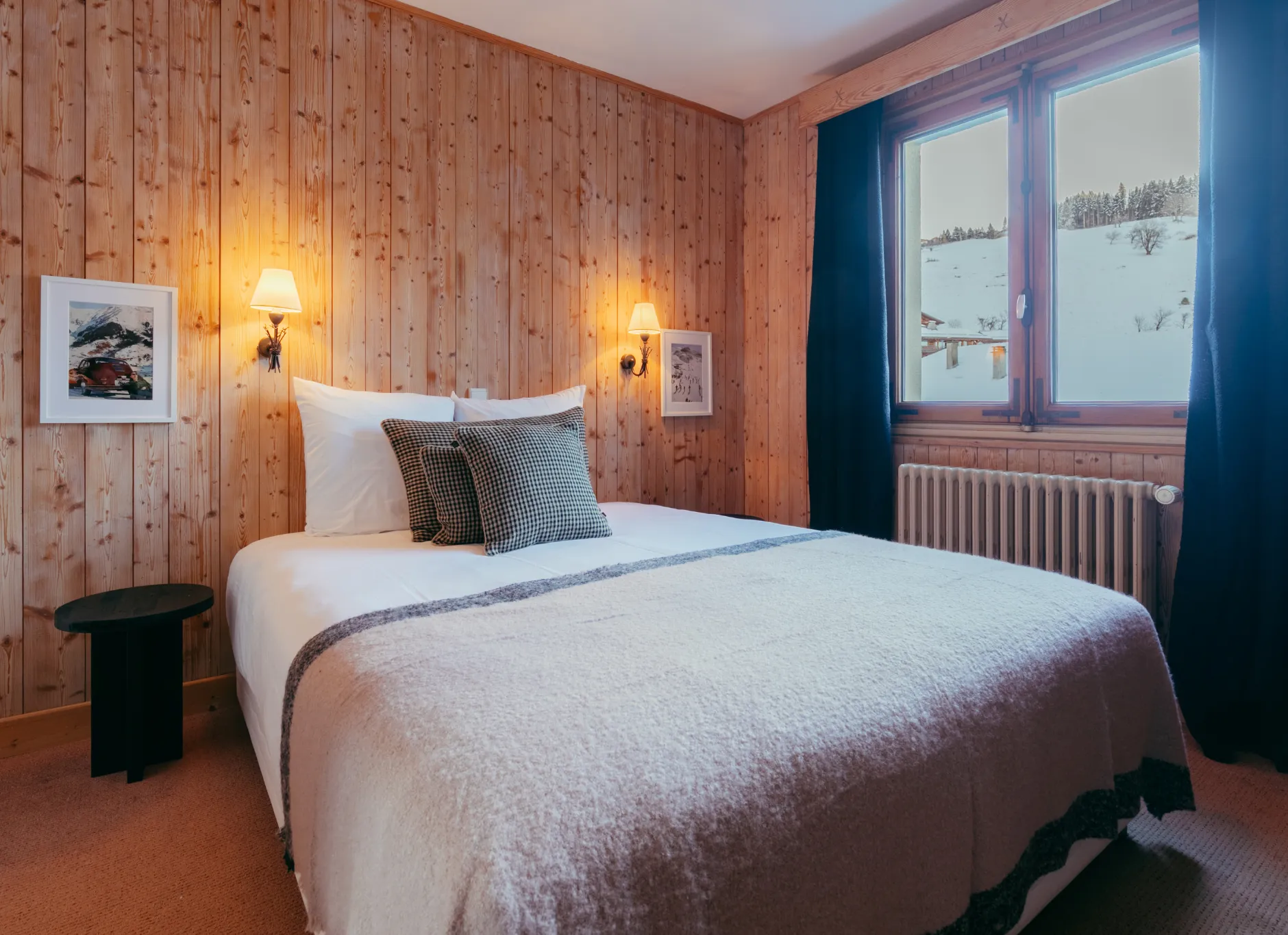 Superior room at Caprice des Neiges in Combloux, decorated in chalet style with mountain views.