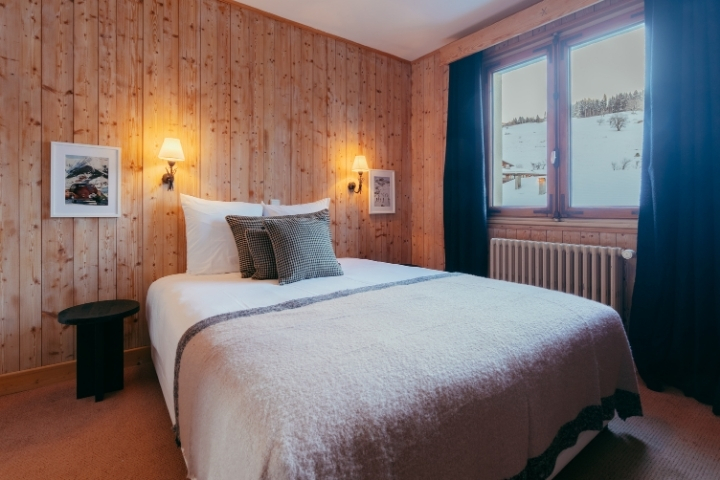 Another corner of the Superior Room with double bed and elegant Alpine decor.