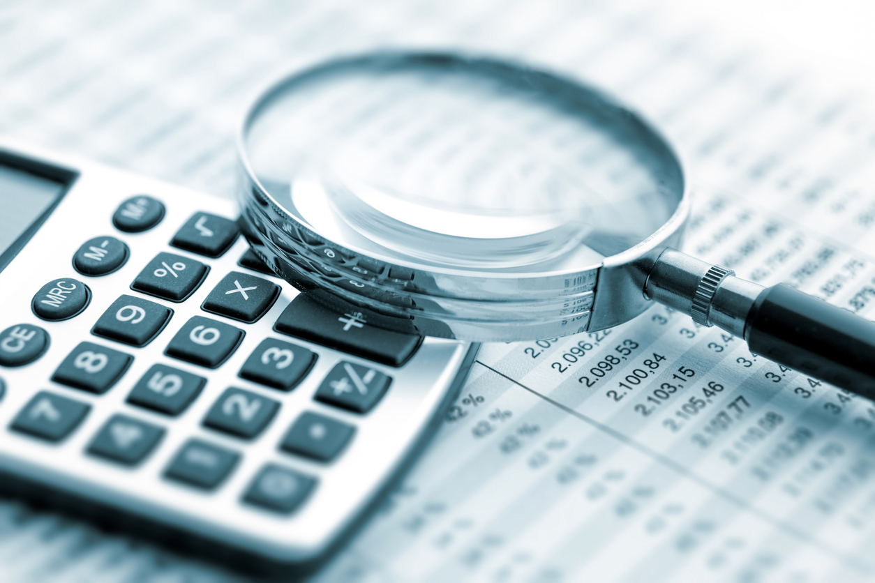 Small business owner preparing tax documents and calculations - essential tax tips for entrepreneurs