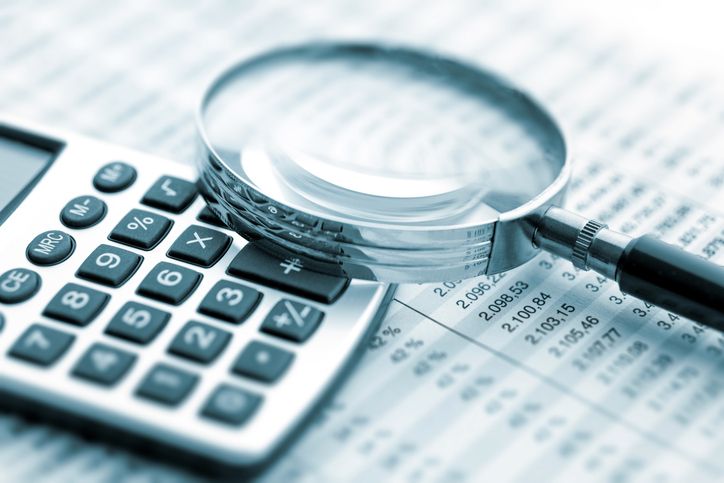 Small business owner preparing tax documents and calculations - essential tax tips for entrepreneurs