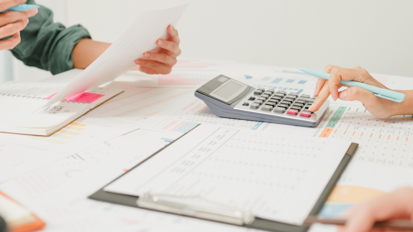 Business owner organizing financial records and receipts - accurate bookkeeping for business growth