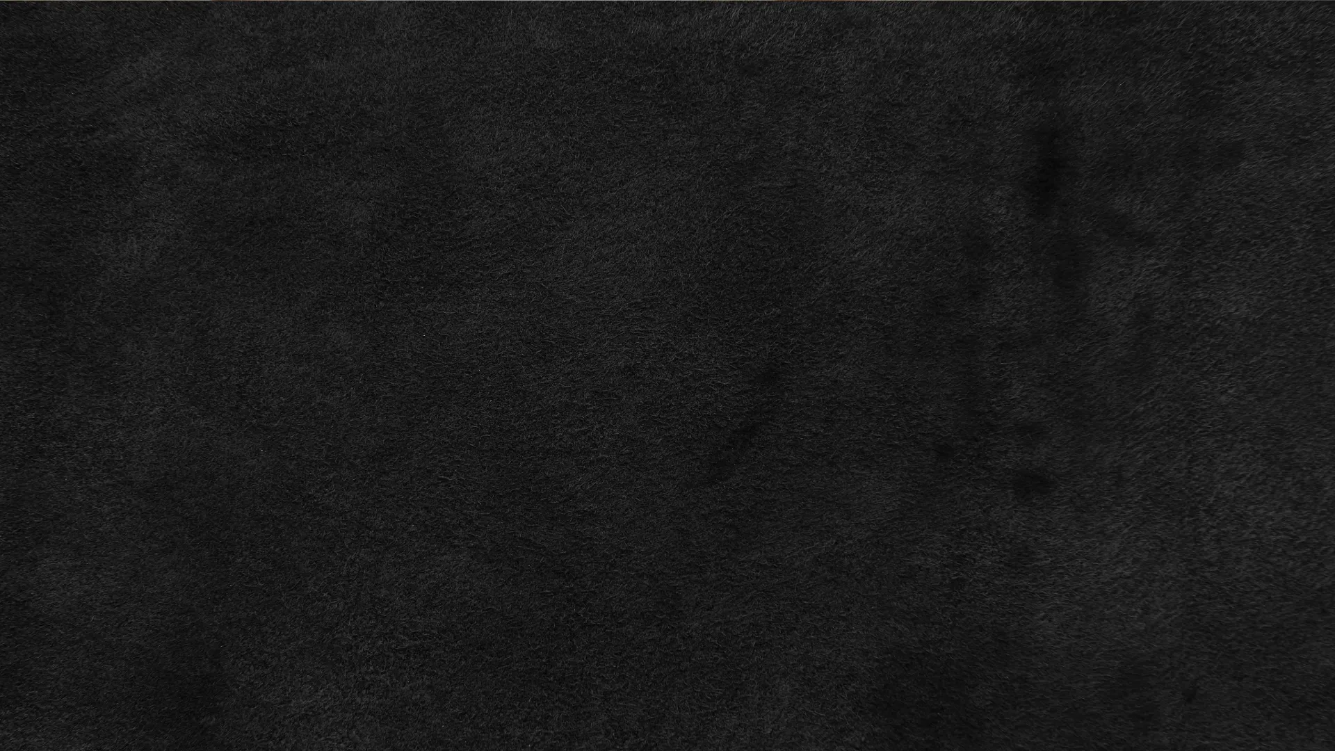 Black textured background.
