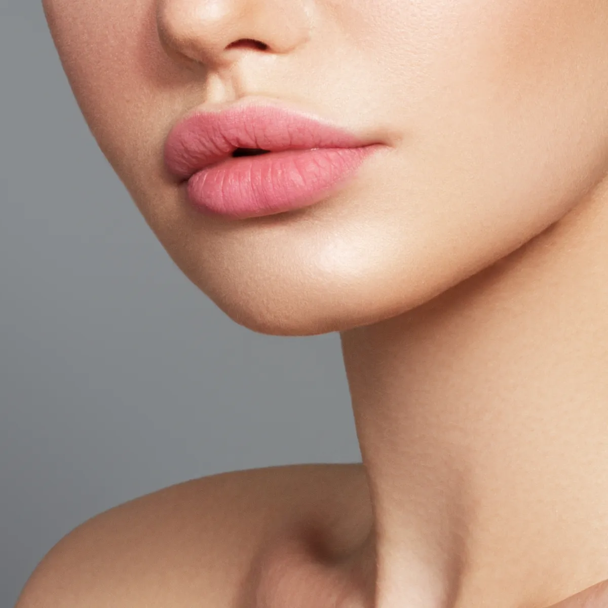 Close-up of a woman's lips and jawline.