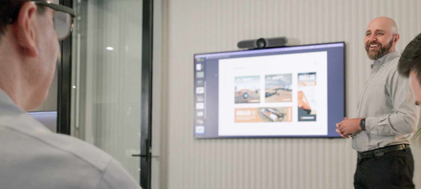 the team at four stripes running a strategy workshop in a coproate office board room