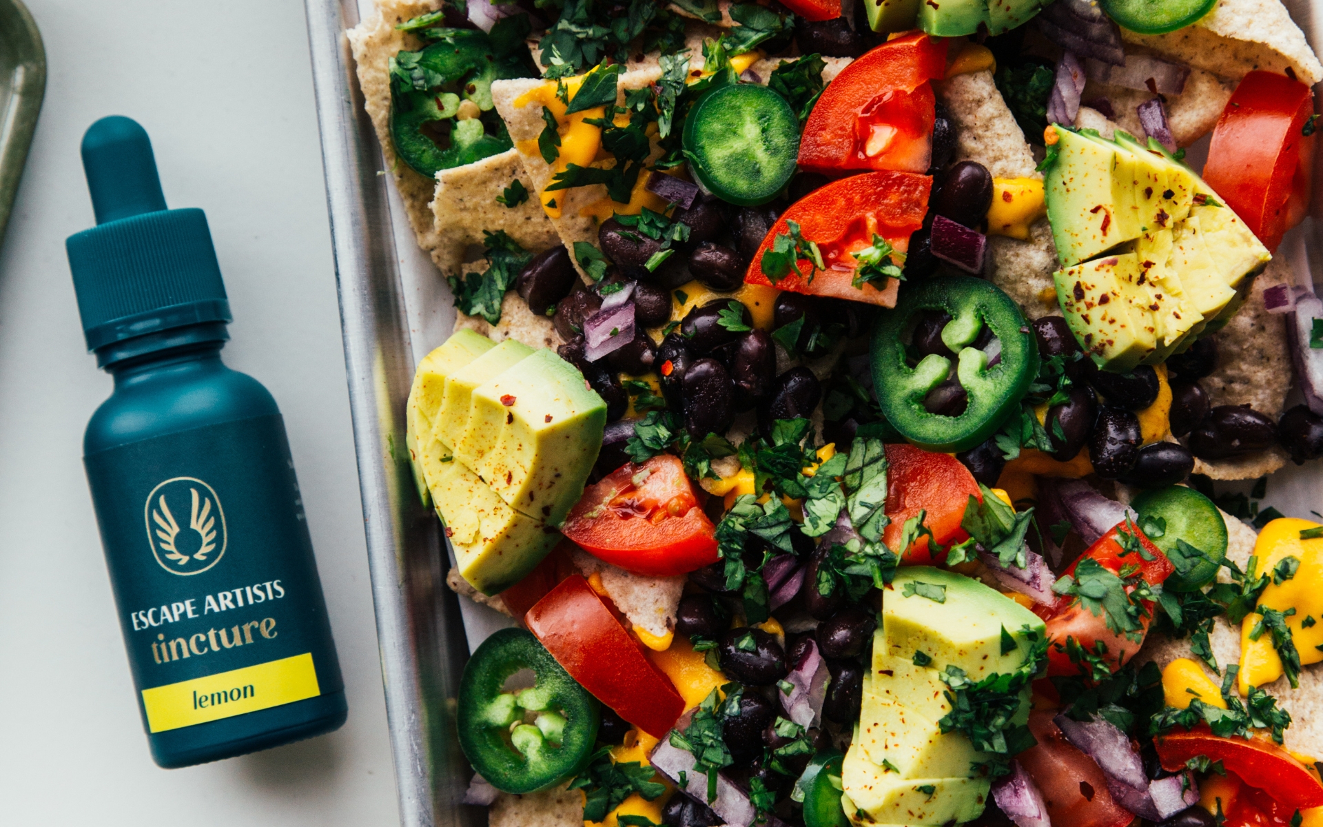 nachos with cashew cheese sauce and lemon tincture