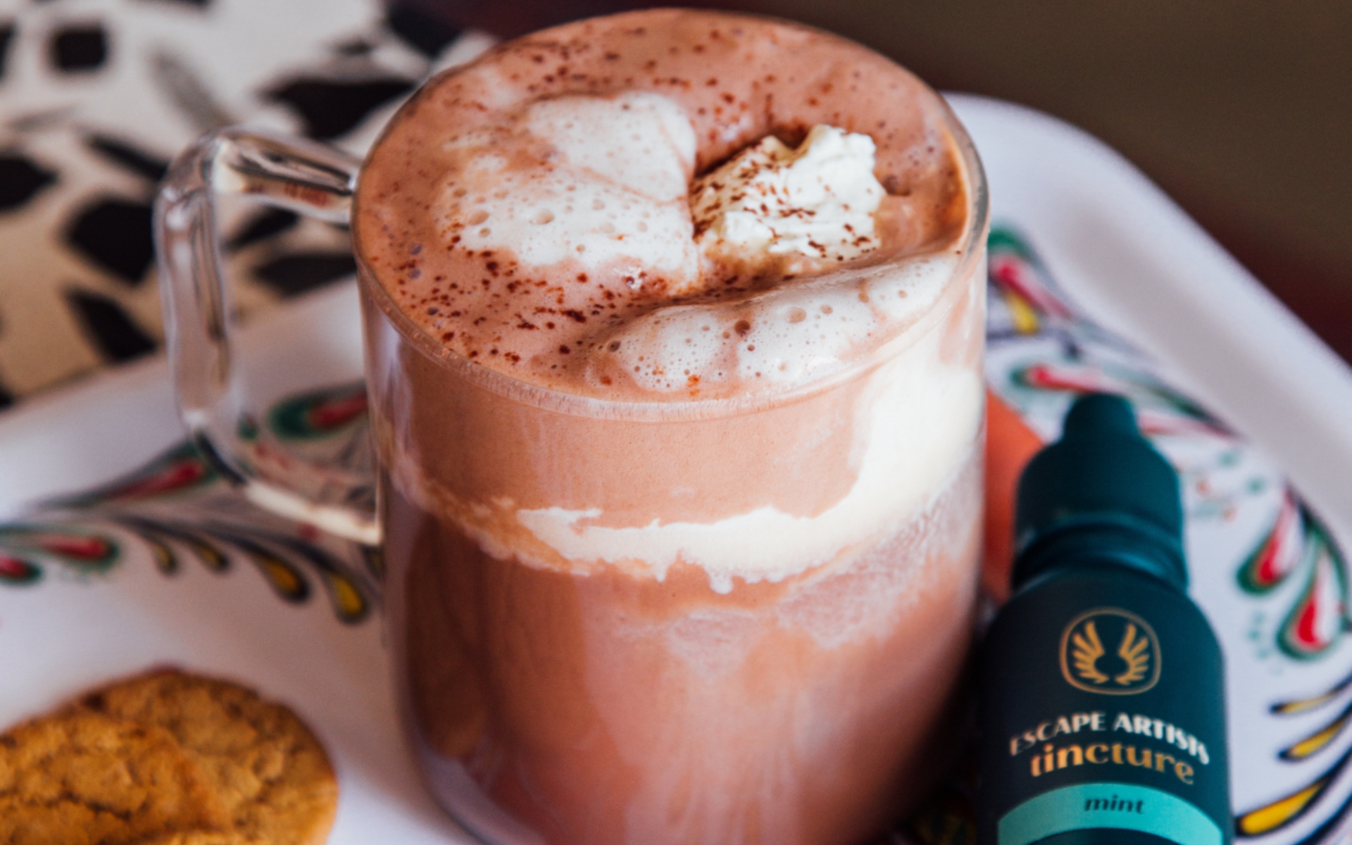 hot cocoa with mint whipped cream and escape artists thc tincture