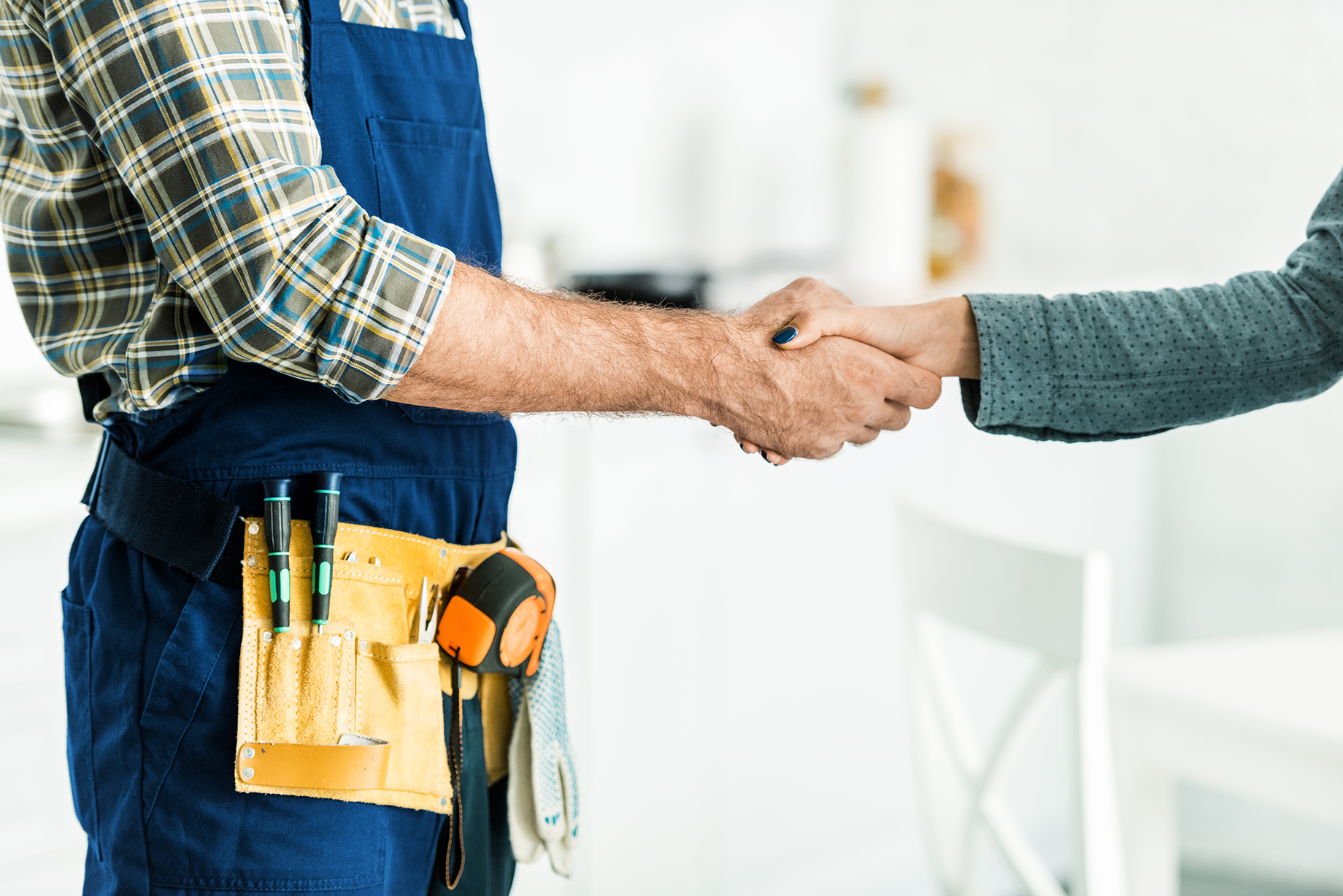 Customer shaking Hands with Plumber