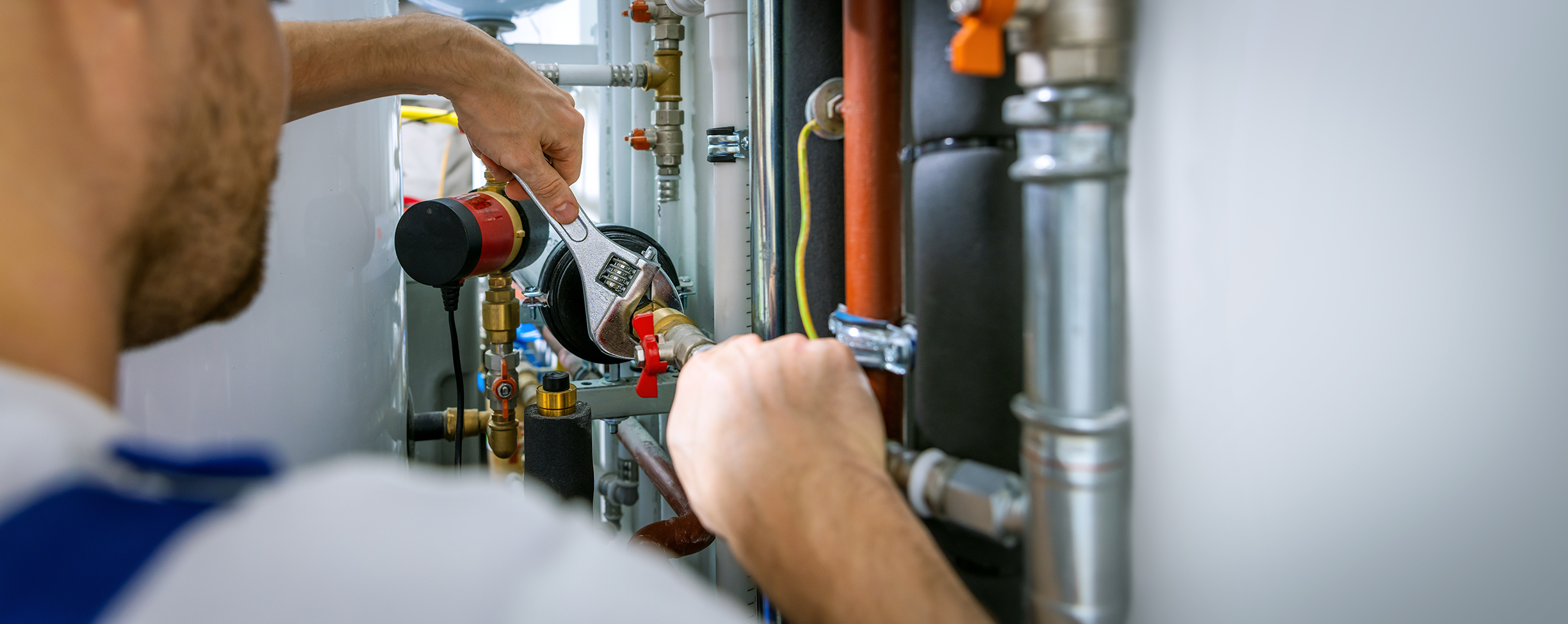 Plumber fixing a pipe