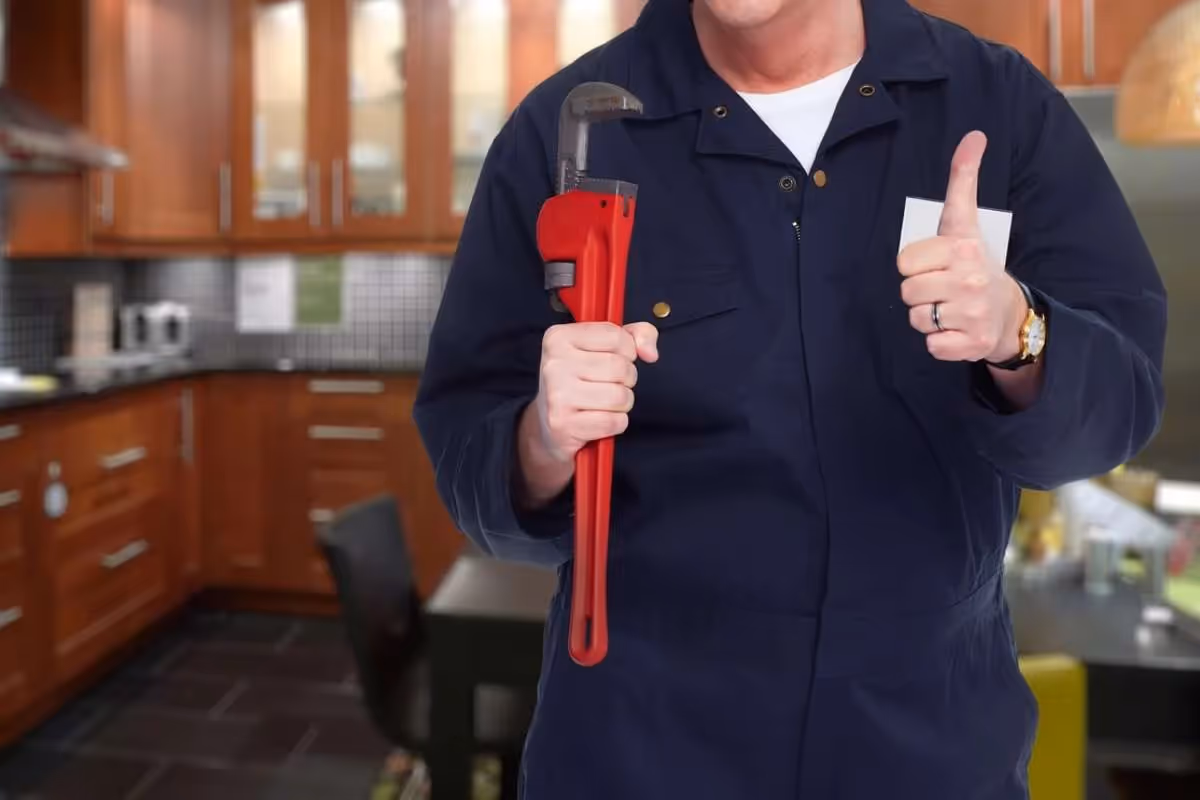 An expert holding a wrench showing a thumb