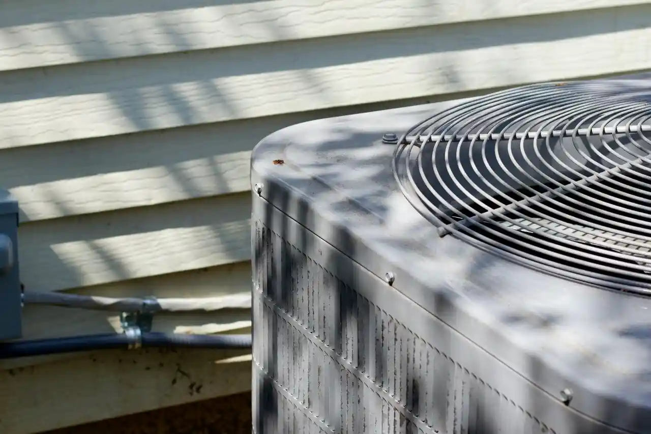 Outdoor AC unit and pipes.