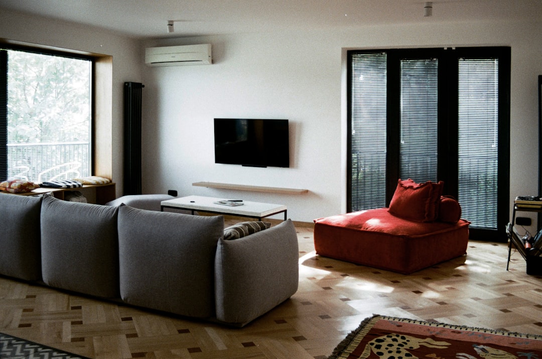 comparing a discreet in-duct unit with other air quality solutions in a living room - duct mounted air purifier