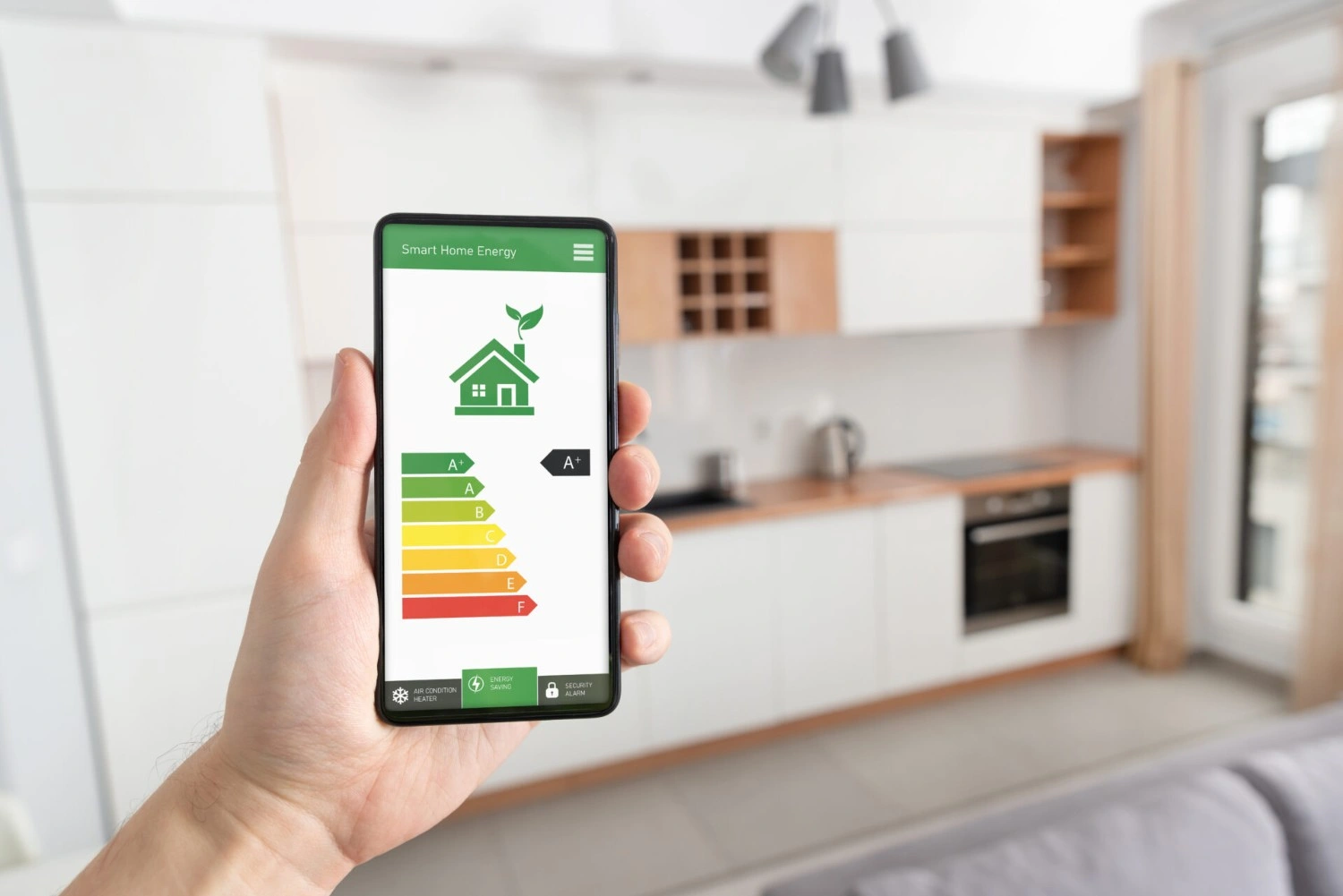Hand holding phone showing energy rating.