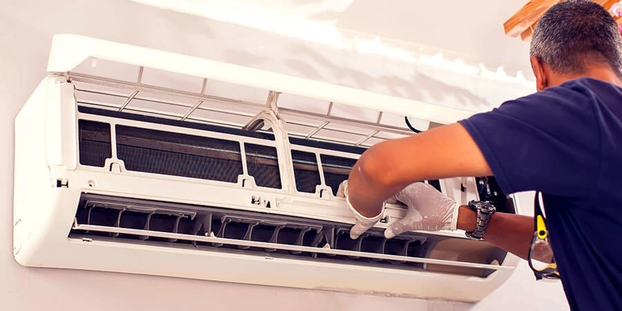 A technician replacing an AC unit.