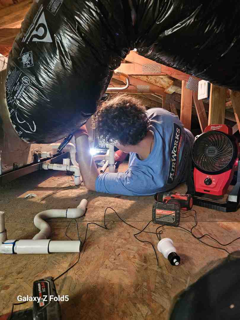 technician inspecting ductwork in an attic - duct sealing moorpark ca technician inspecting ductwork in an attic - duct sealing moorpark ca