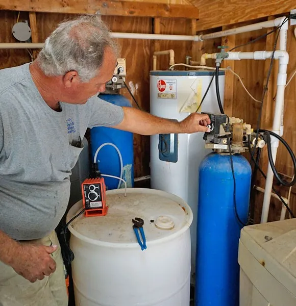 Man working on water treatment system