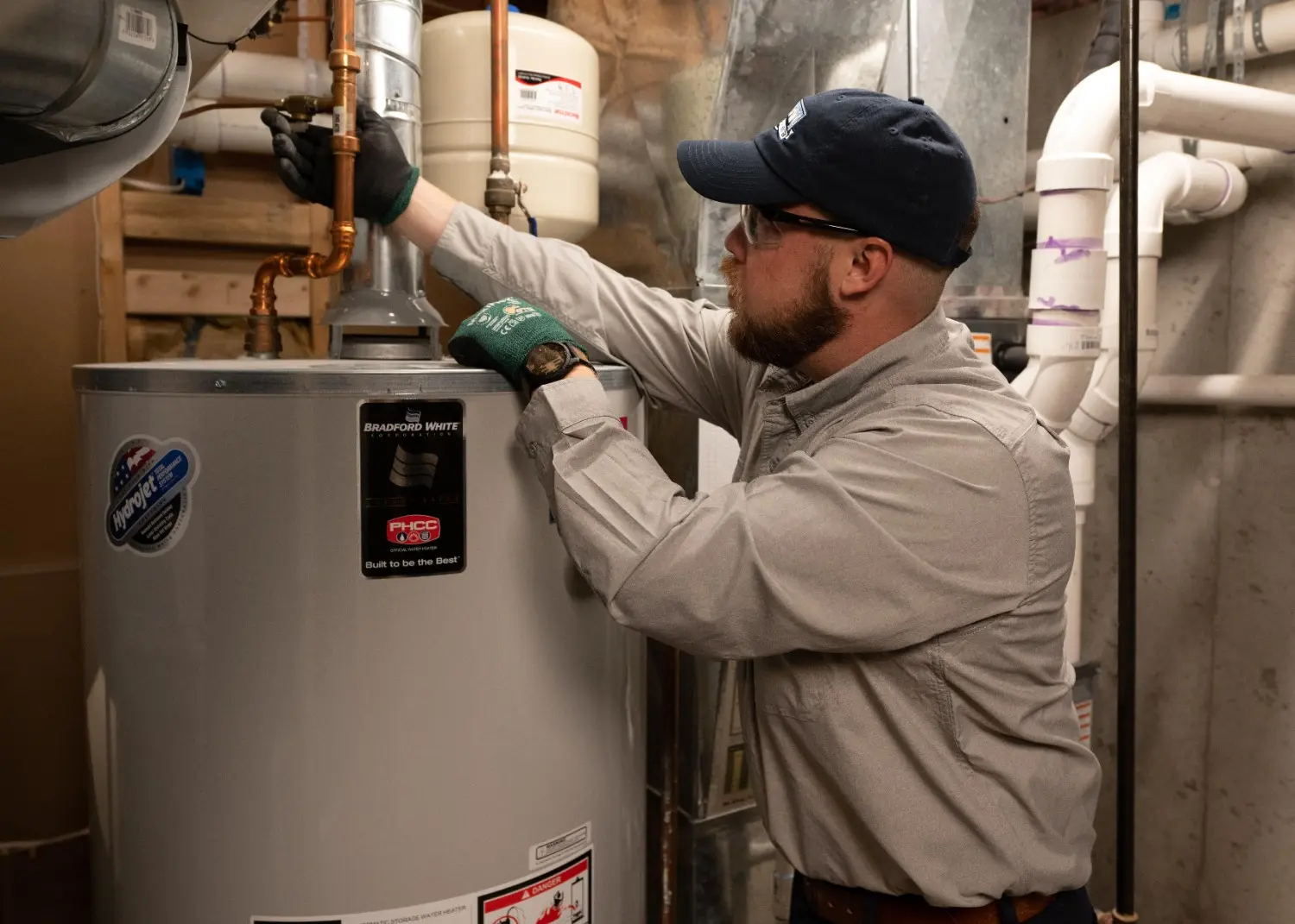 Technician working on a water heater