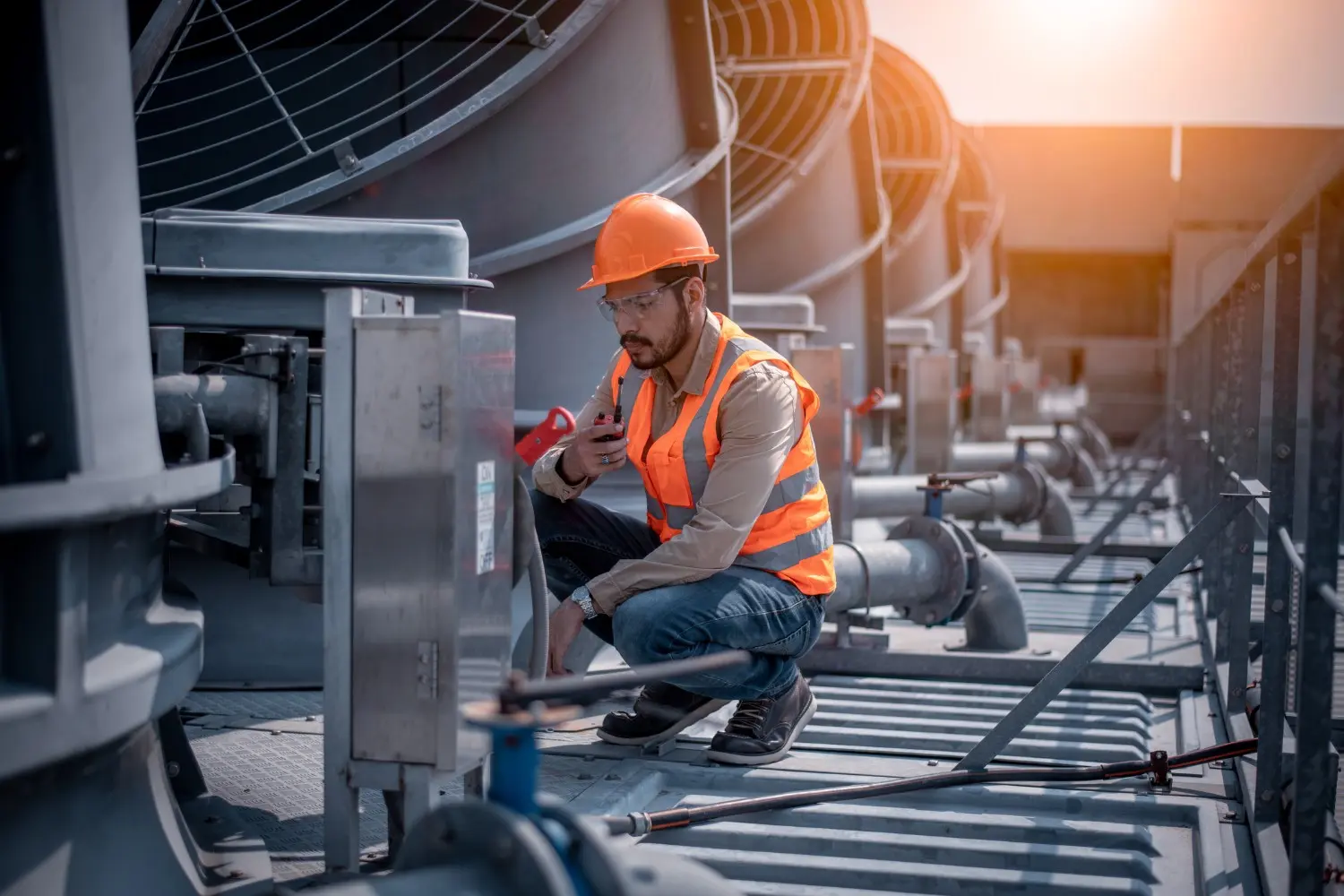Industrial technician checking large HVAC unit