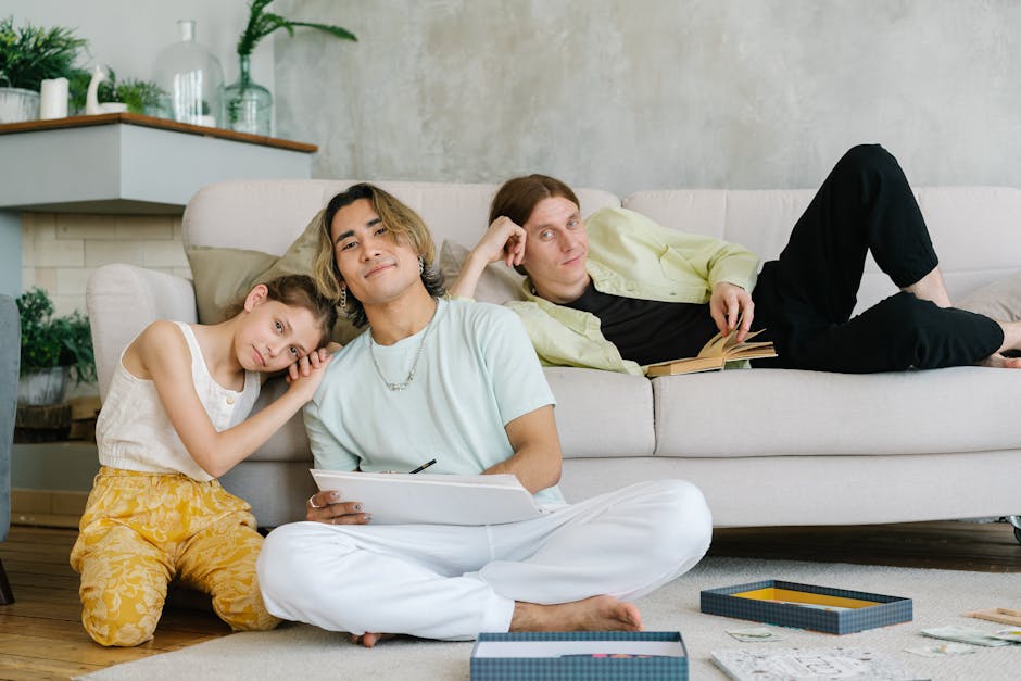 A happy family relaxing comfortably in their modern living room, enjoying perfect indoor temperatures. - smart thermostat installation ventura county