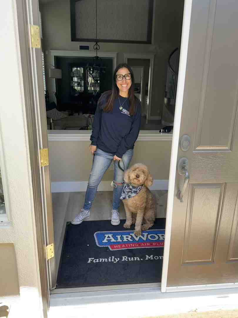 A friendly, uniformed plumber shaking hands with a satisfied homeowner. - plumbing service newbury park ca