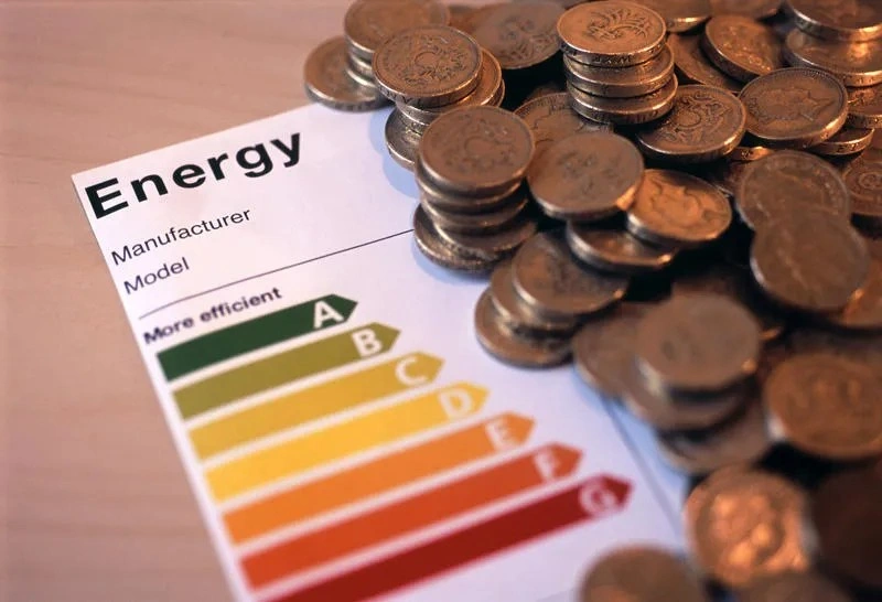 Energy efficiency rating with money coins.