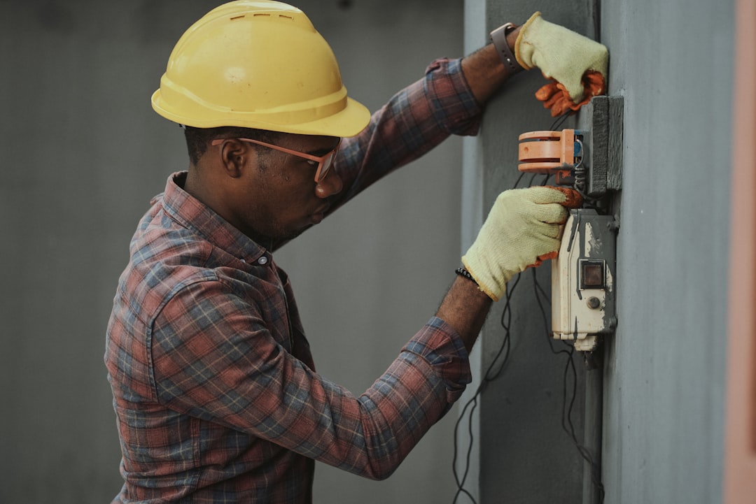 Certified technician carefully installing an outdoor heat pump unit, connecting refrigerant lines - heat pump installation thousand oaks