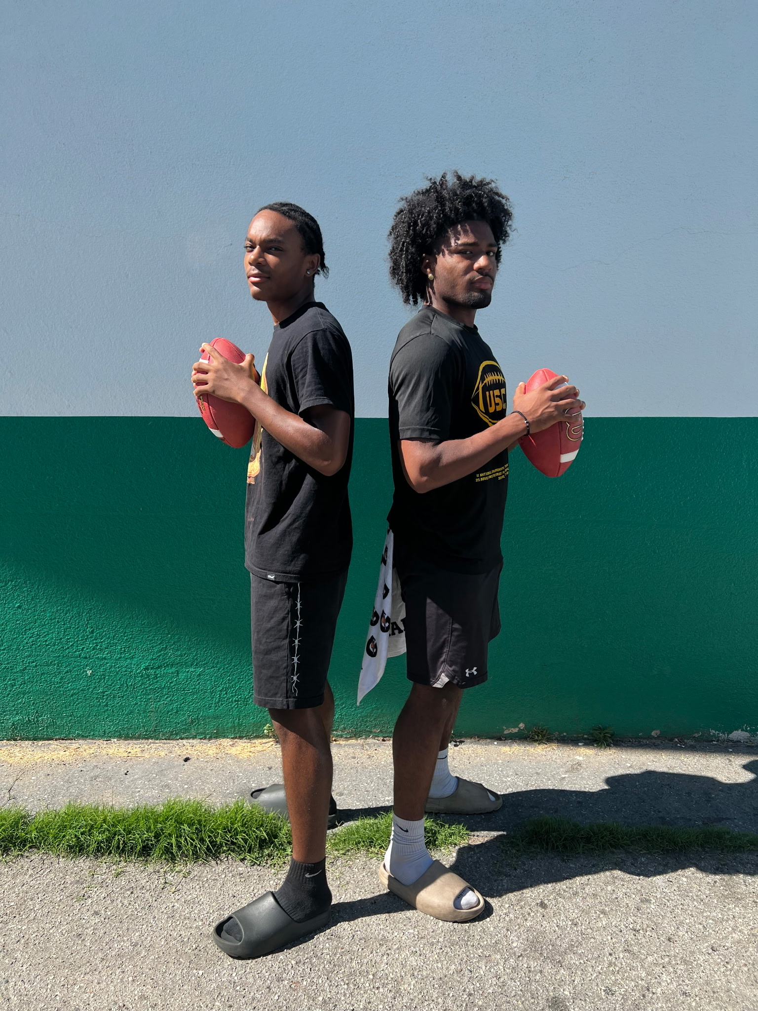 Second image of two football players at a meetup we had in Washington 2025