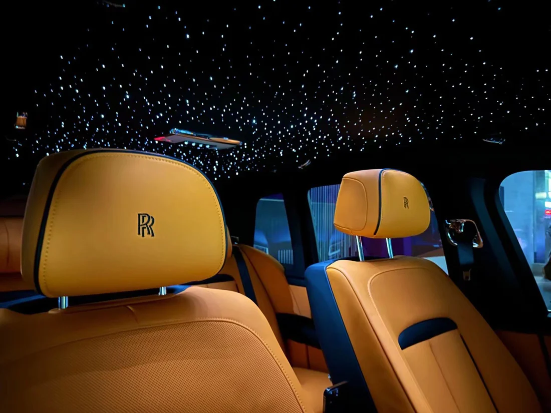 the inside of a car with a black sky and stars