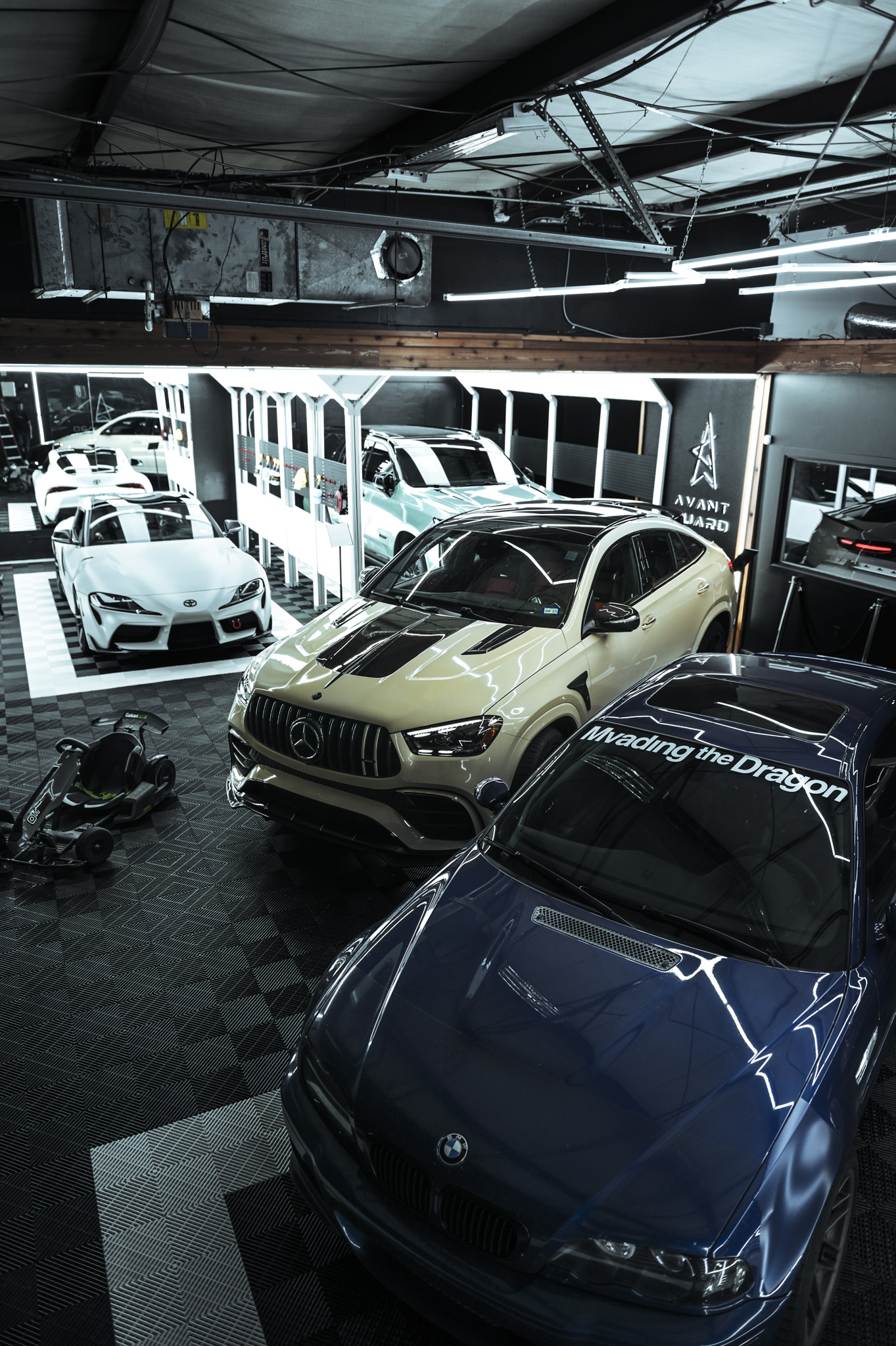 a group of cars in a garage