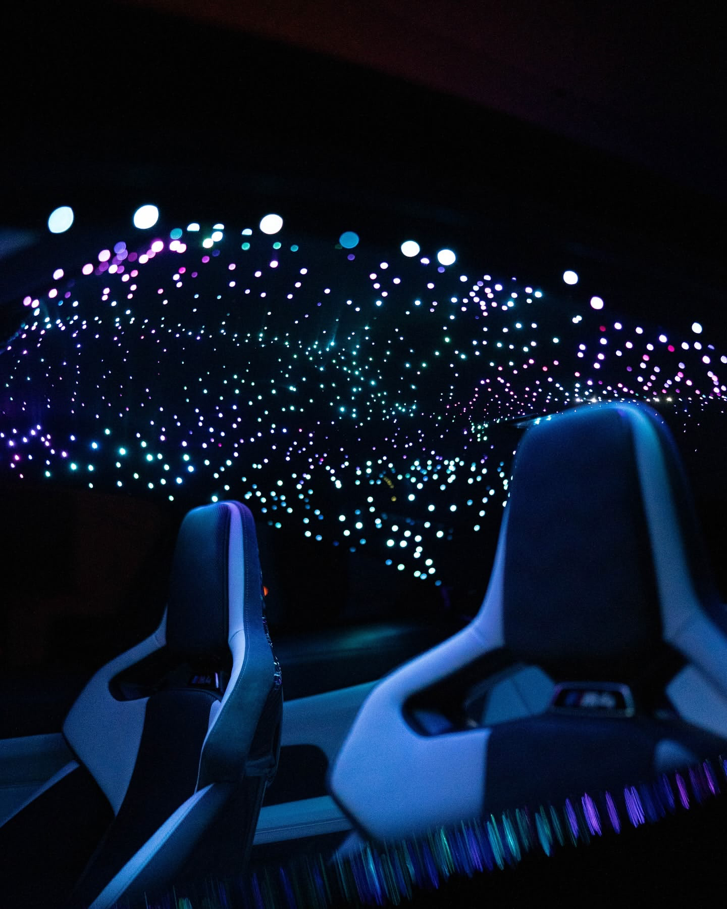 a car with lights in the sky