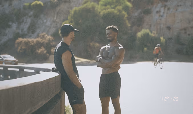Two men in conversation, opening up and connecting deeply.