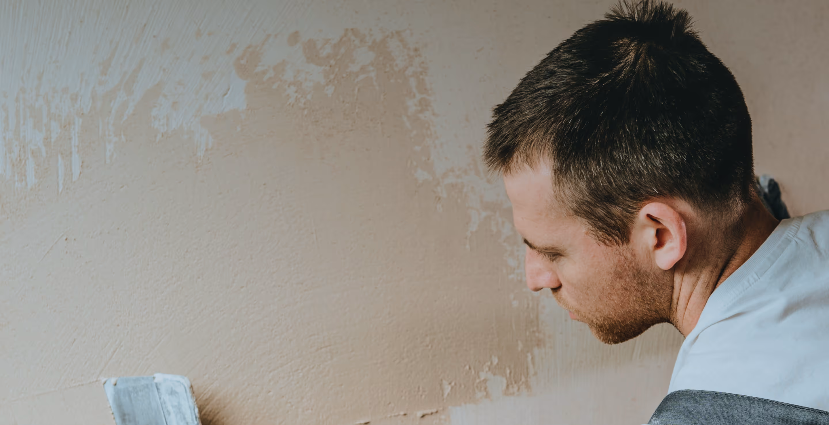 Man painting a wall