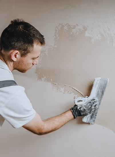 Man working on a wall