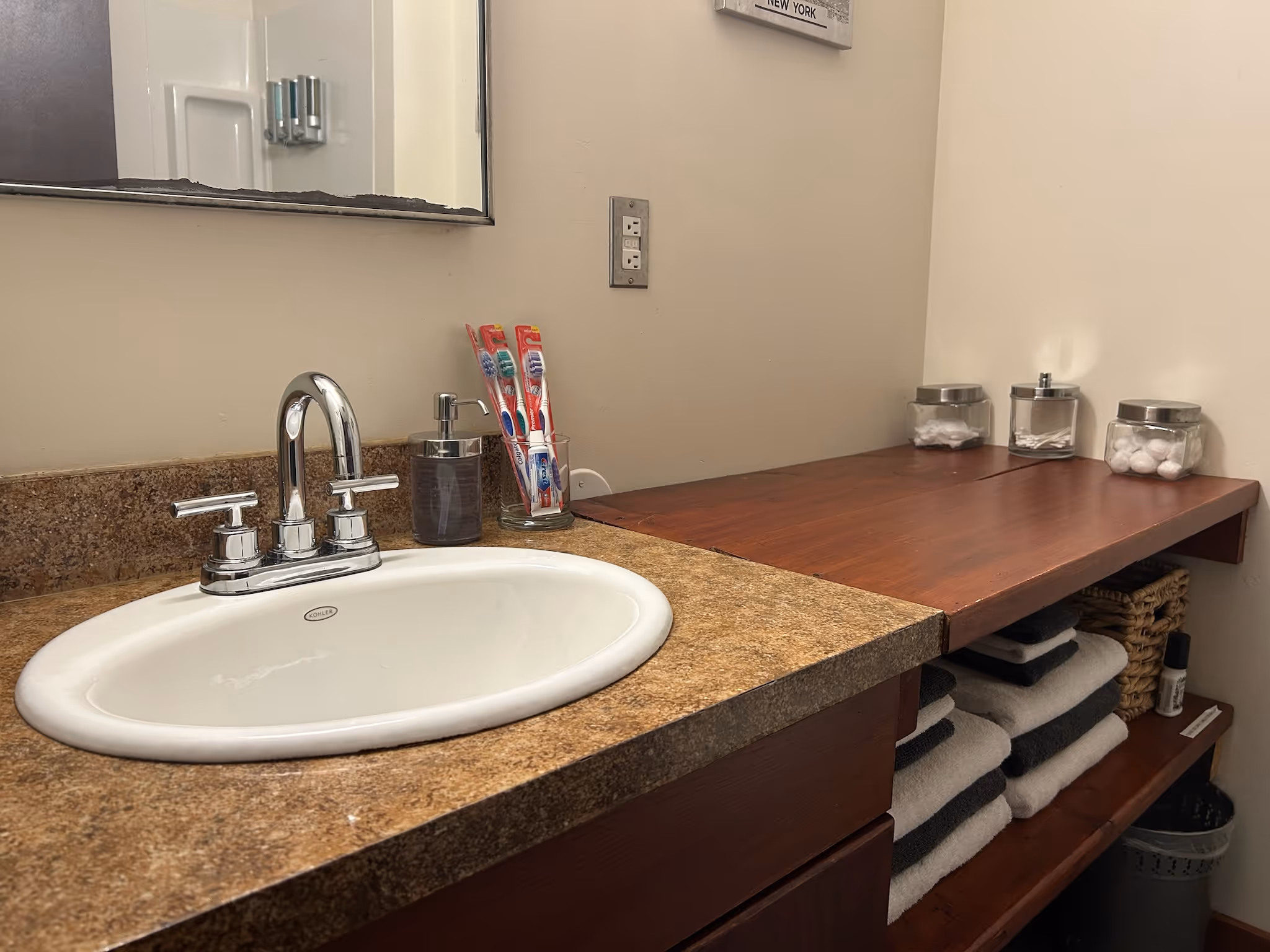 bathroom counter, sink and mirror
