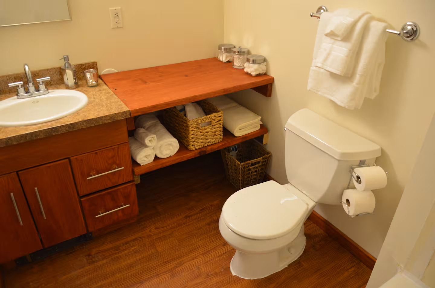 bathroom sink, counter, and toilet