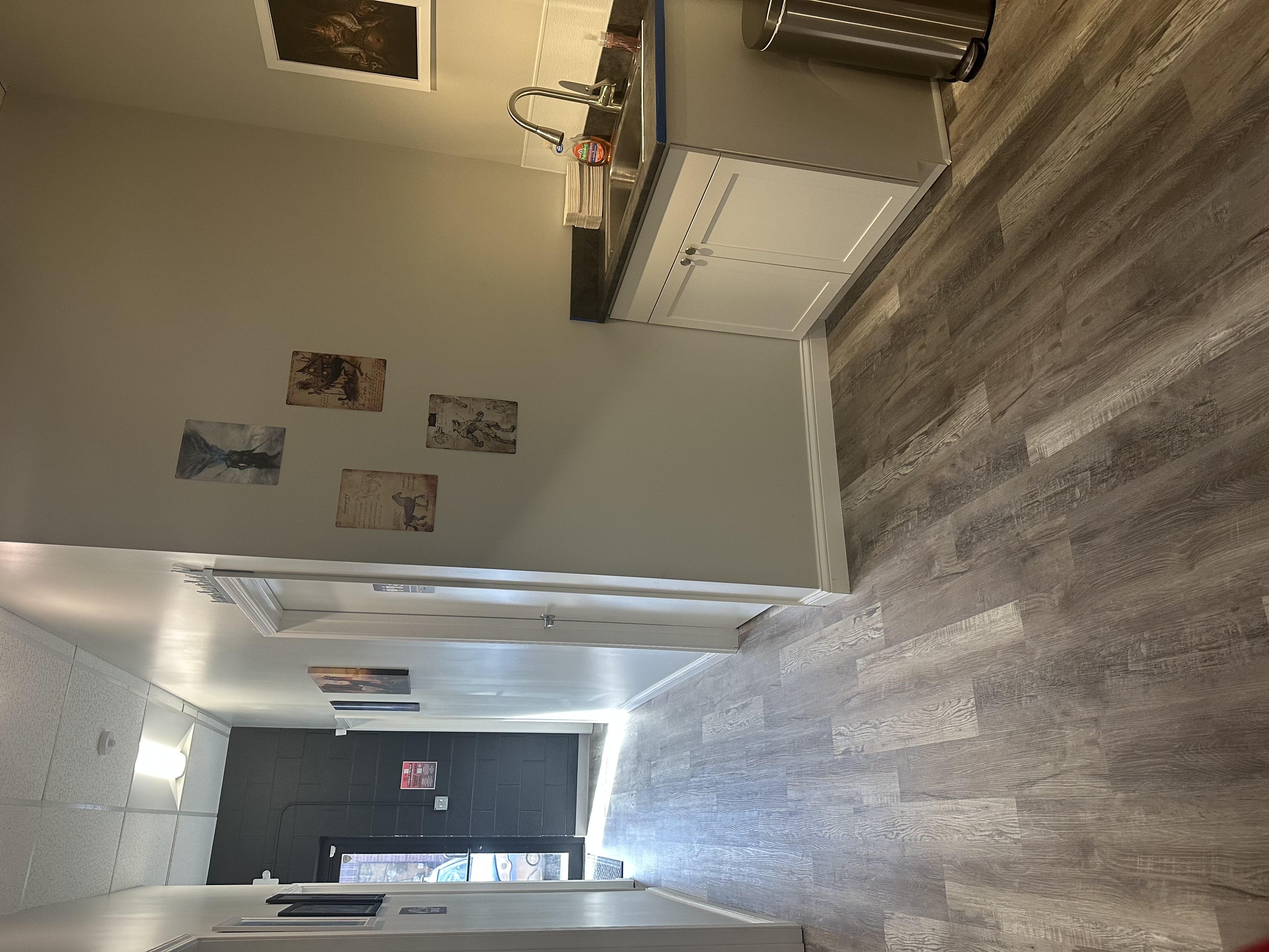 Hallway to private rooms and bathrooms