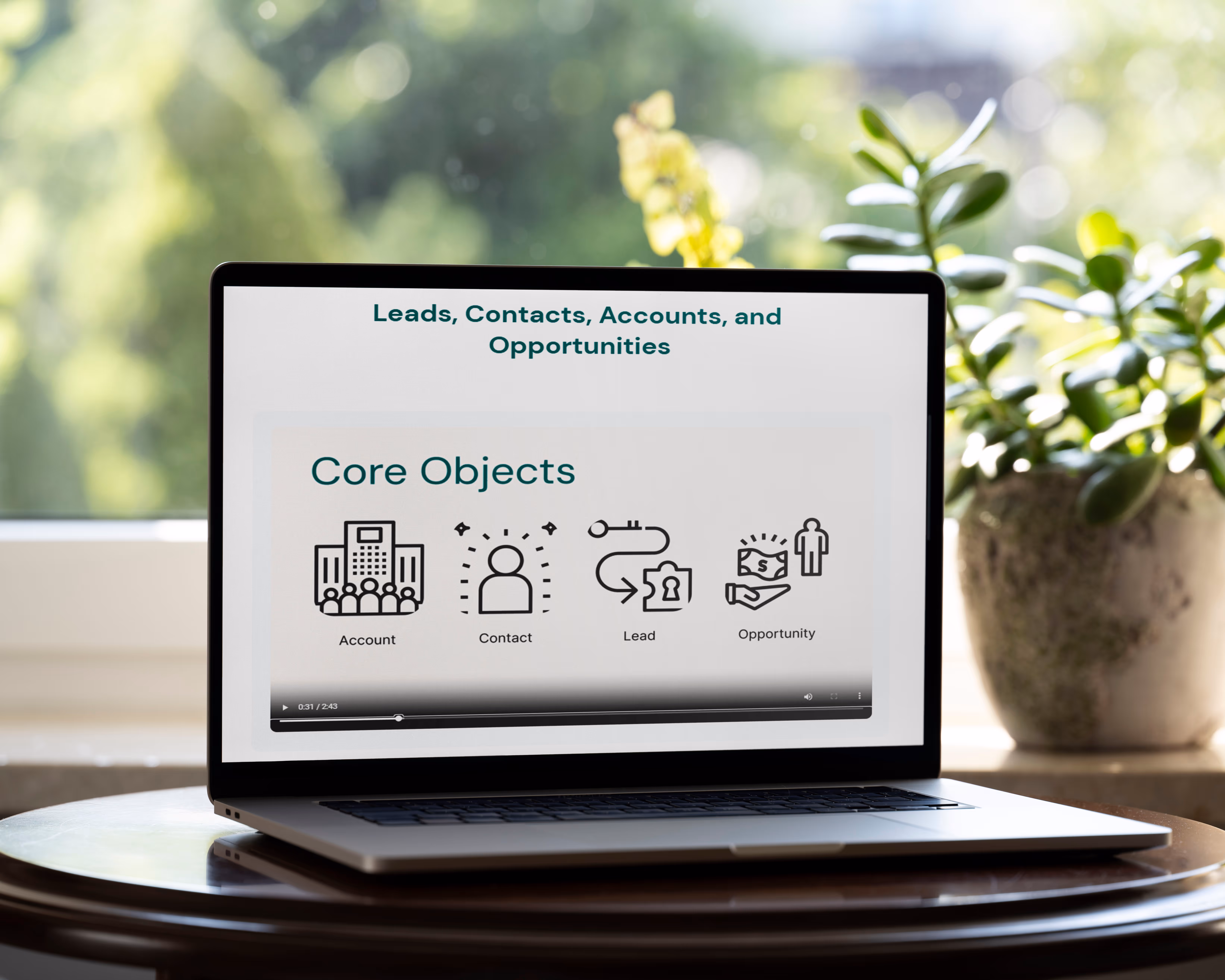 Computer on table with microlesson on the screen. 