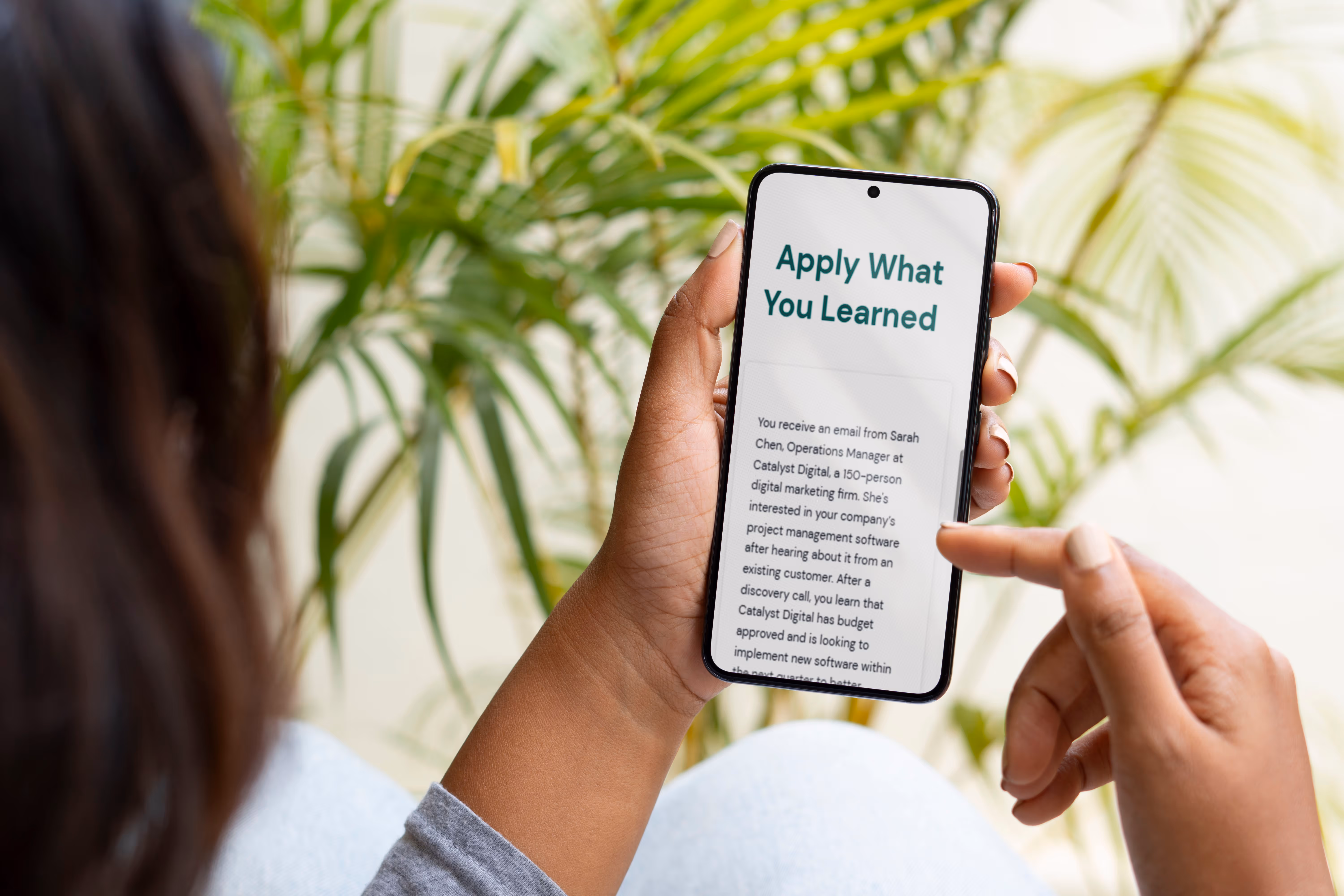 Close up photo of person viewing lesson on iPhone.