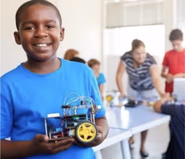 Boy showing motor project