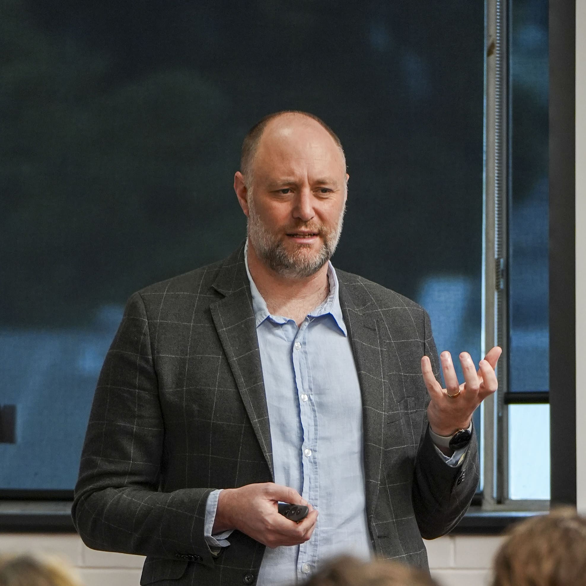 The founder of the AI Training Company, Shaun Davies, runs a consulting session with an executive team teaching AI policy and governance. 