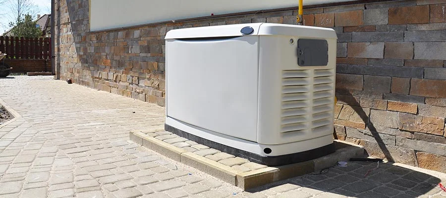 White whole-house standby generator outdoors.