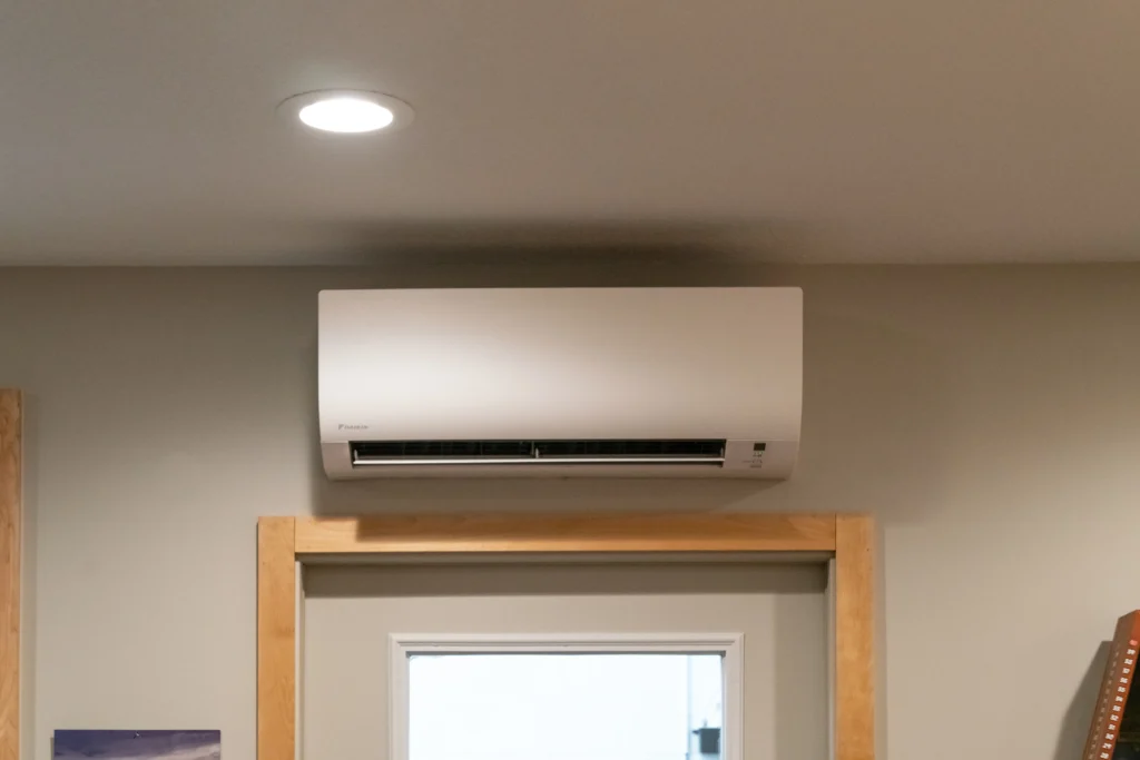 Ductless heat pump installation in a modern interior setting, showcasing energy-efficient air conditioning solutions by Stafford Home Service in Minneapolis, MN.