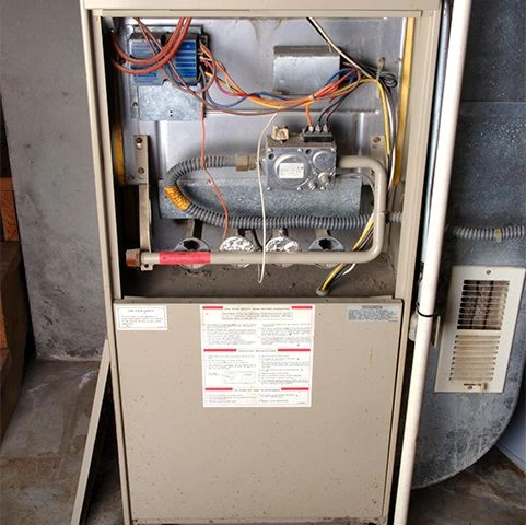 Furnace installation unit with visible wiring and components, emphasizing heating service efficiency in Minneapolis, MN.