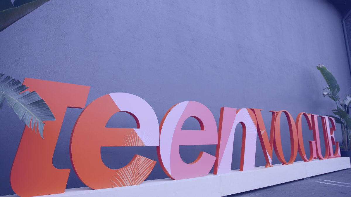 A big, eye-catching sign with the text "Teen Magazine," designed to attract a young audience.