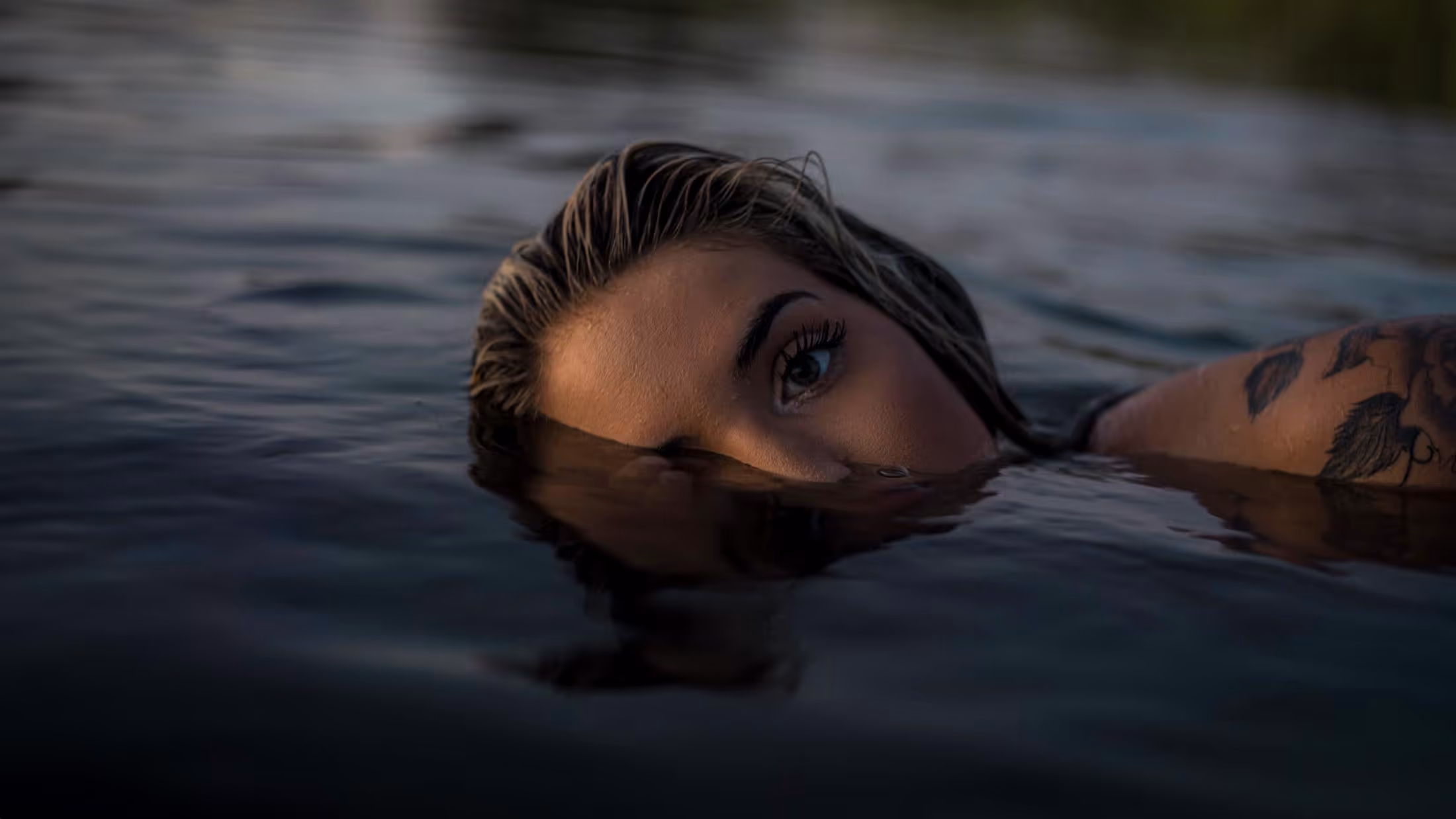 image of artist creating a tattoo